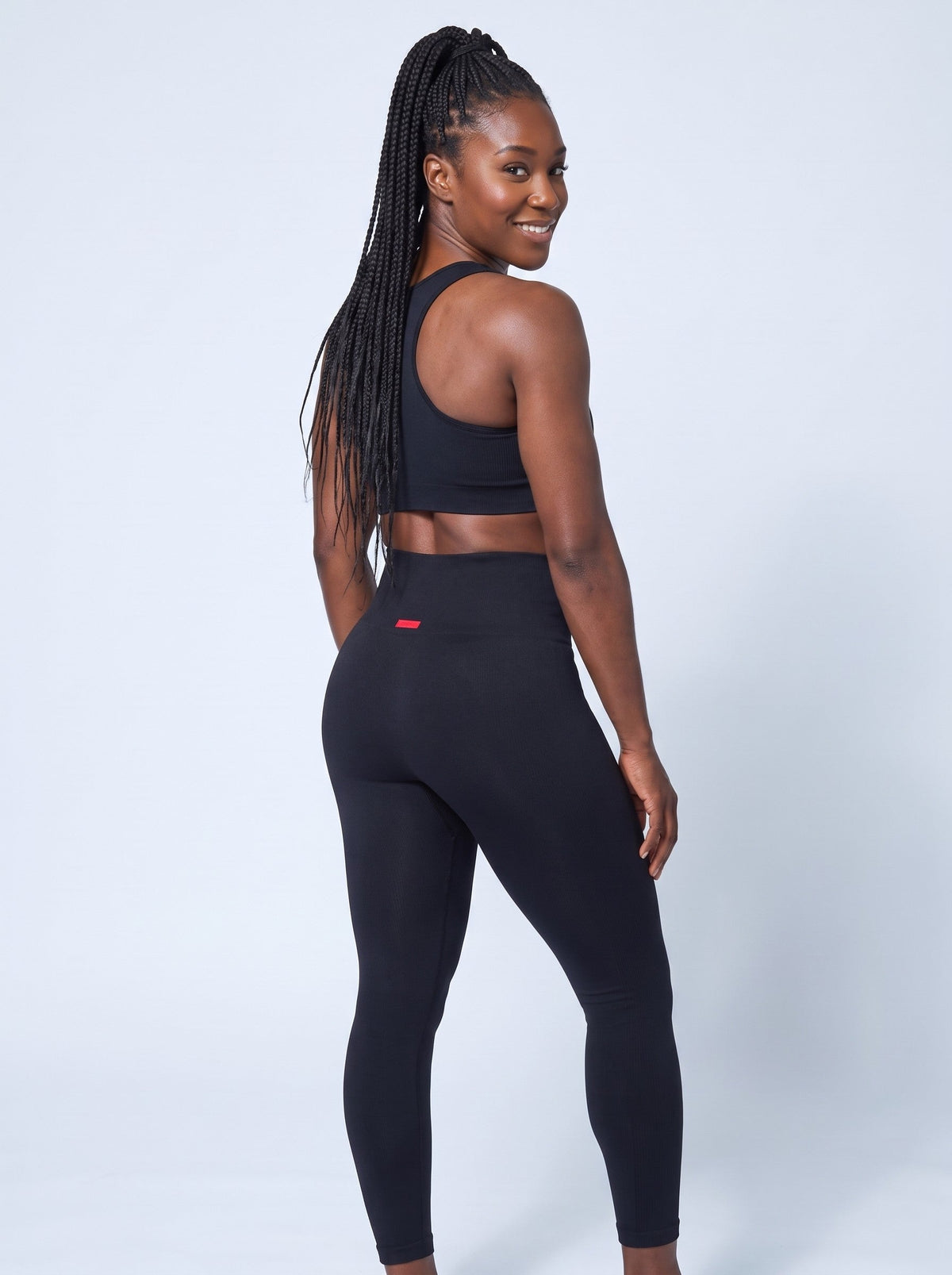 Lava Sports Bra Top in Black, back, worn with the Lava Leggings