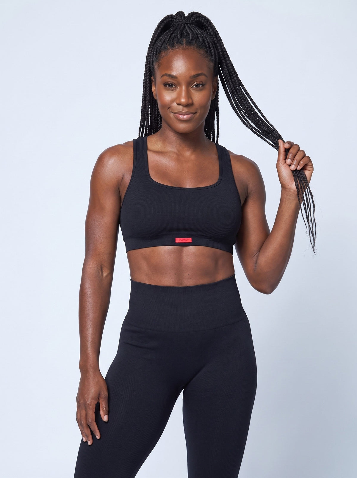 Lava Sports Bra Top in Black, front, on model