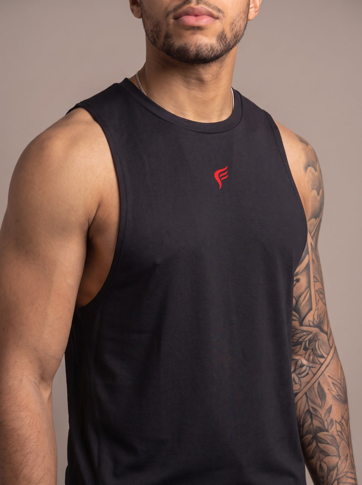 Men's Performance Tank in Black, chest logo close-up