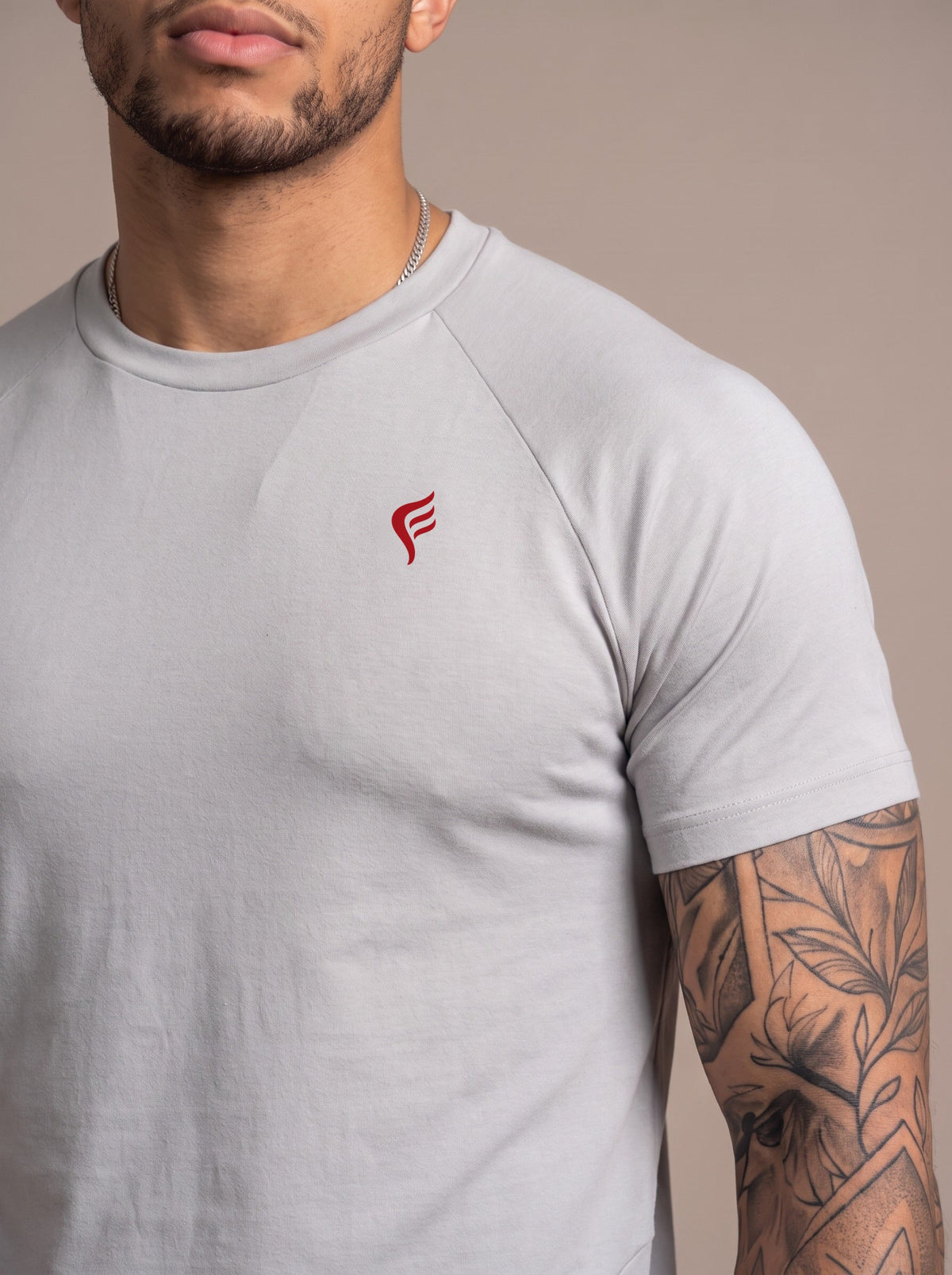 Men's Performance Tee in Gray, chest logo close-up