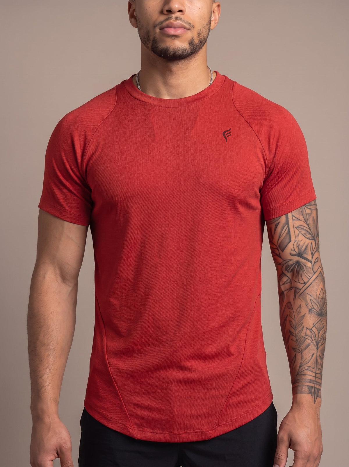 Men's Performance Tee in Red, chest logo close-up