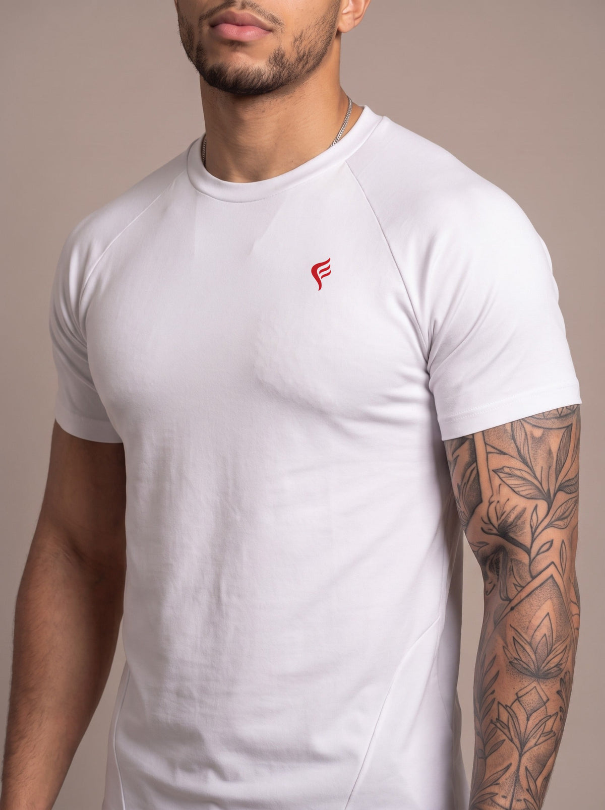 Men's Performance Tee in White, chest logo close-up