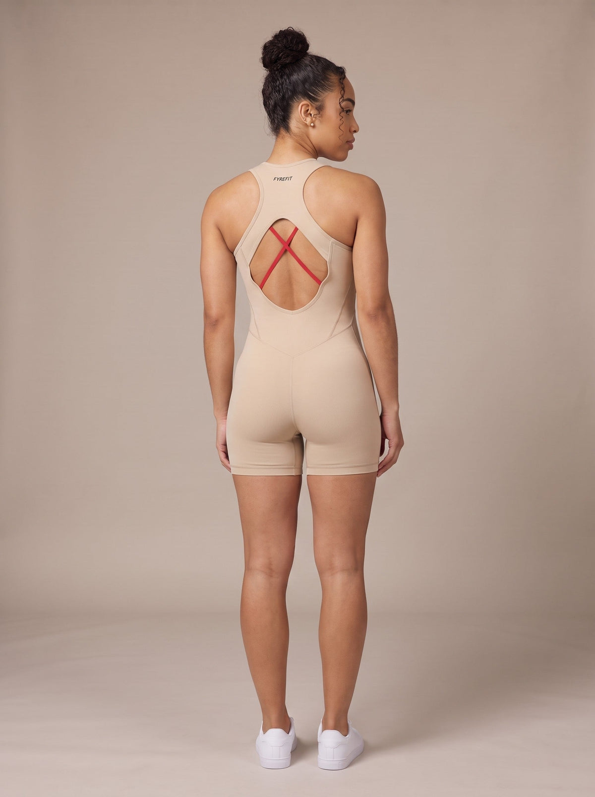 Women's Racerback Bodysuit in Macadamia, back, on model