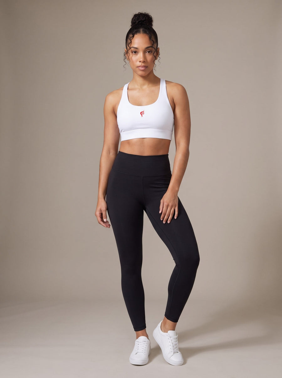 Women's Racerback Sports Bra in White, front, on model